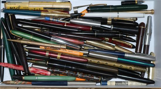 A collection of pens, books on pens and a Bonhams catalogue